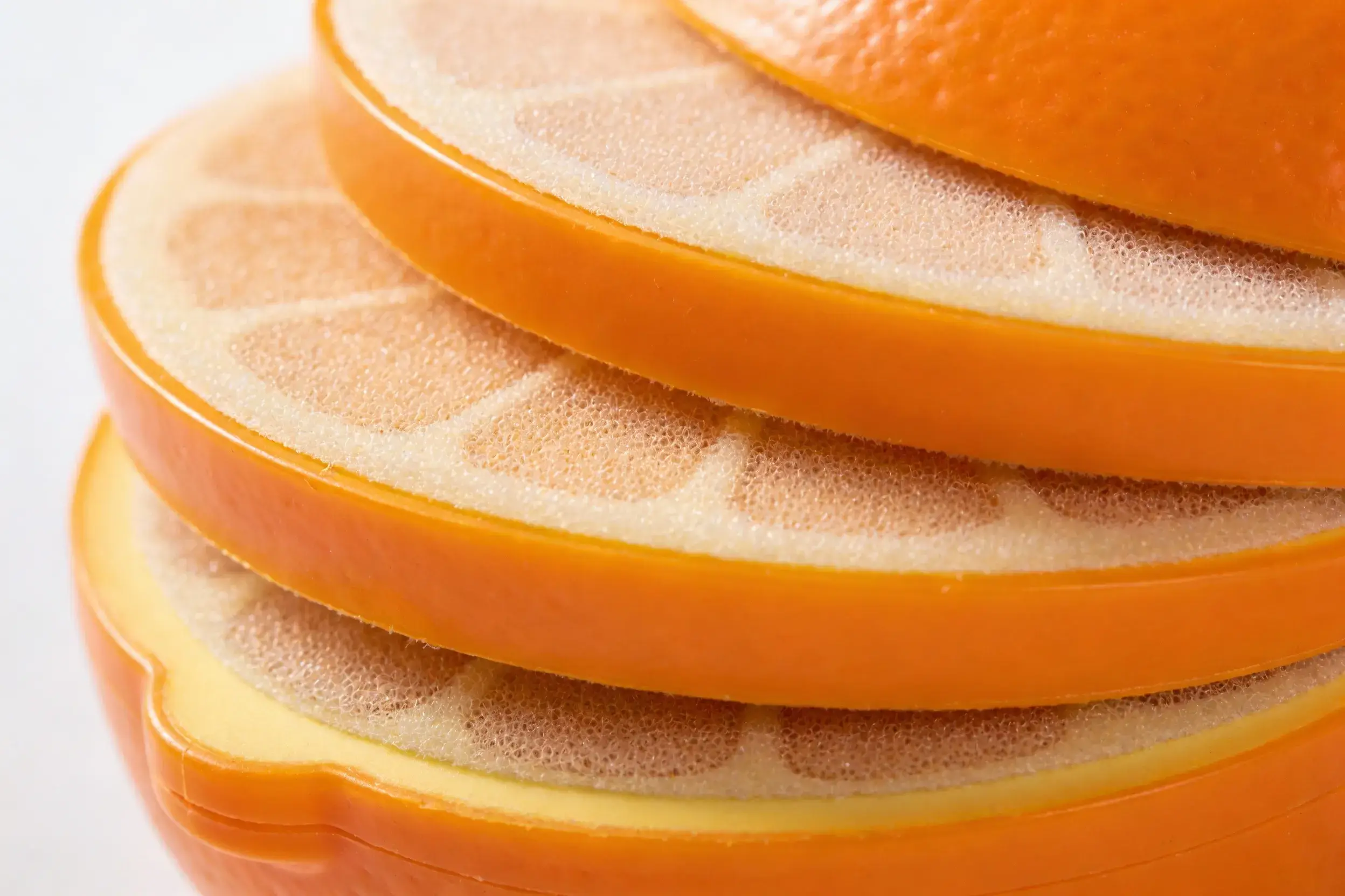 Close-up of Velcro layers on a peelable fruit toy, with visible texture